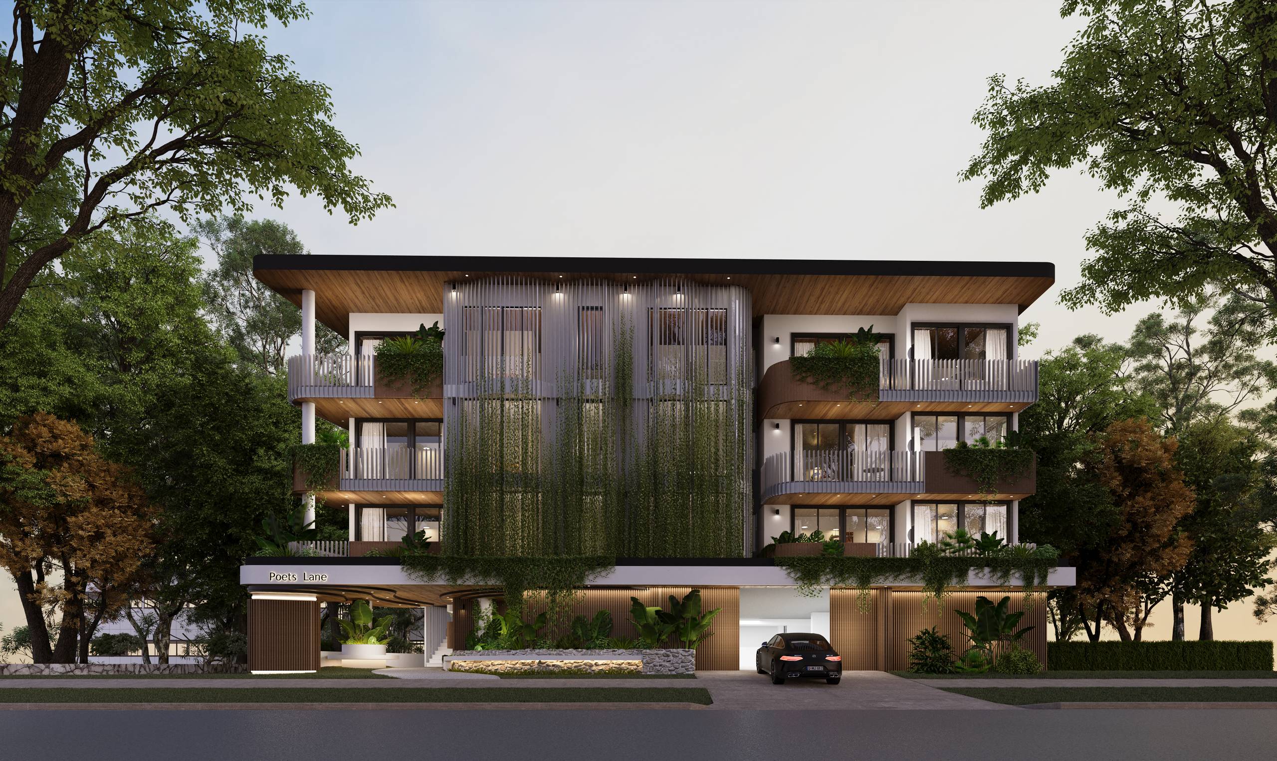 Nighttime view of the Poets Lane apartment development from Lane Street, highlighting architectural lighting and landscaped surrounds