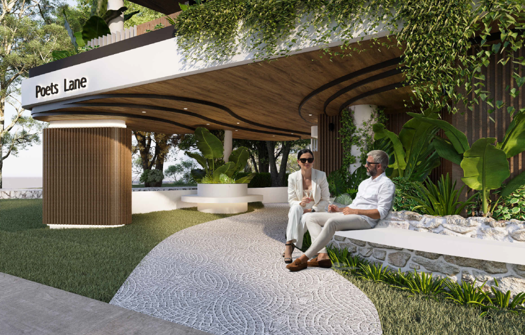 The entryway of Poets Lane, showcasing the modern architecture and lush landscaping that leads to the building.
